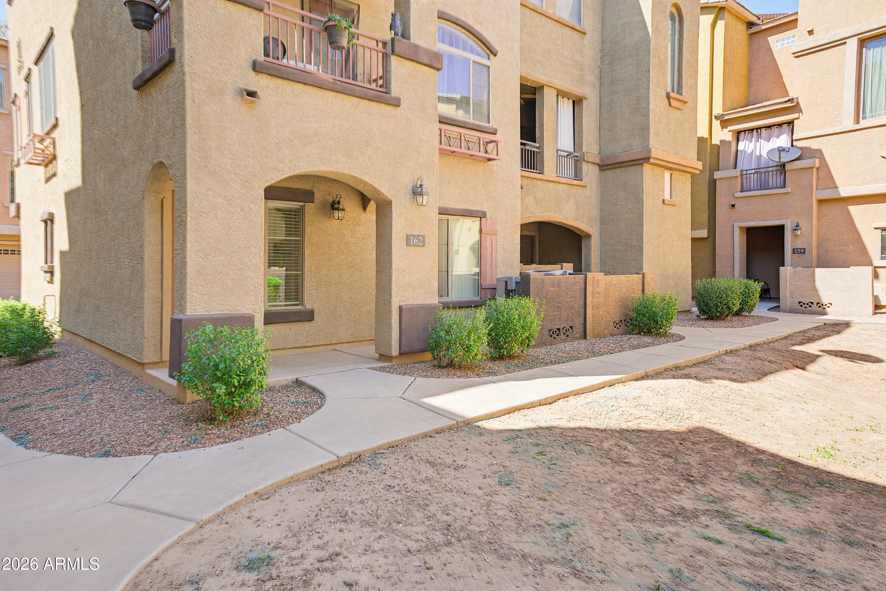 3250 West Greenway Road, Unit 162 Phoenix, AZ 85053 - Photo 28 of 31 a front view of a multi story building