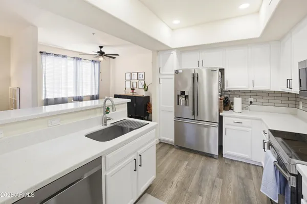 a kitchen with a sink stove and refrigerator