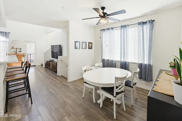 a view of a dining room with furniture window and wooden floor