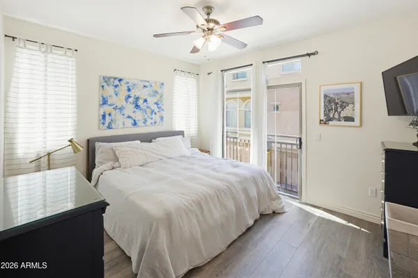 a bedroom with a large bed and a window