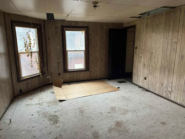 an empty room with windows