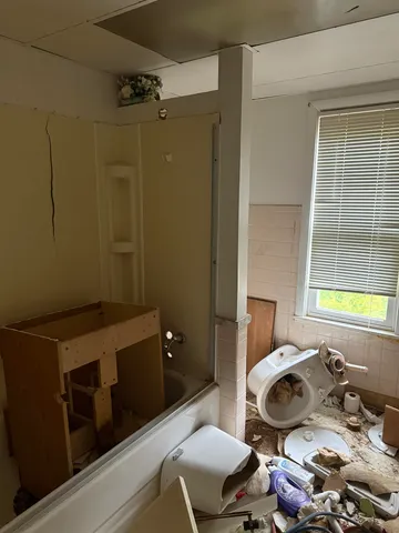 a bathroom with a sink and a window