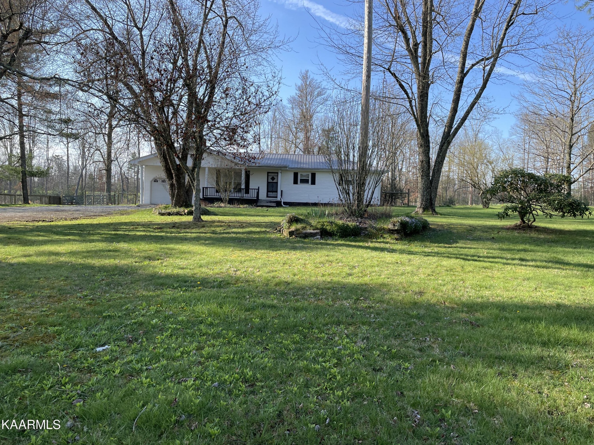 2360 Roslin Road Clarkrange, TN 38553 - Photo 2 of 58 a view of a house in a big yard with large trees
