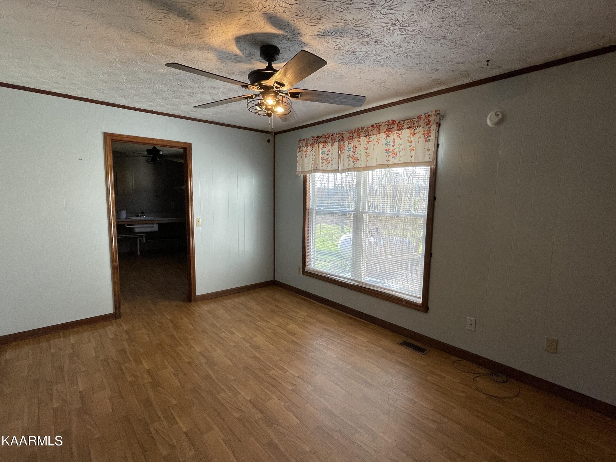 2360 Roslin Road Clarkrange, TN 38553 - Photo 24 of 58 an empty room with wooden floor chandelier and windows