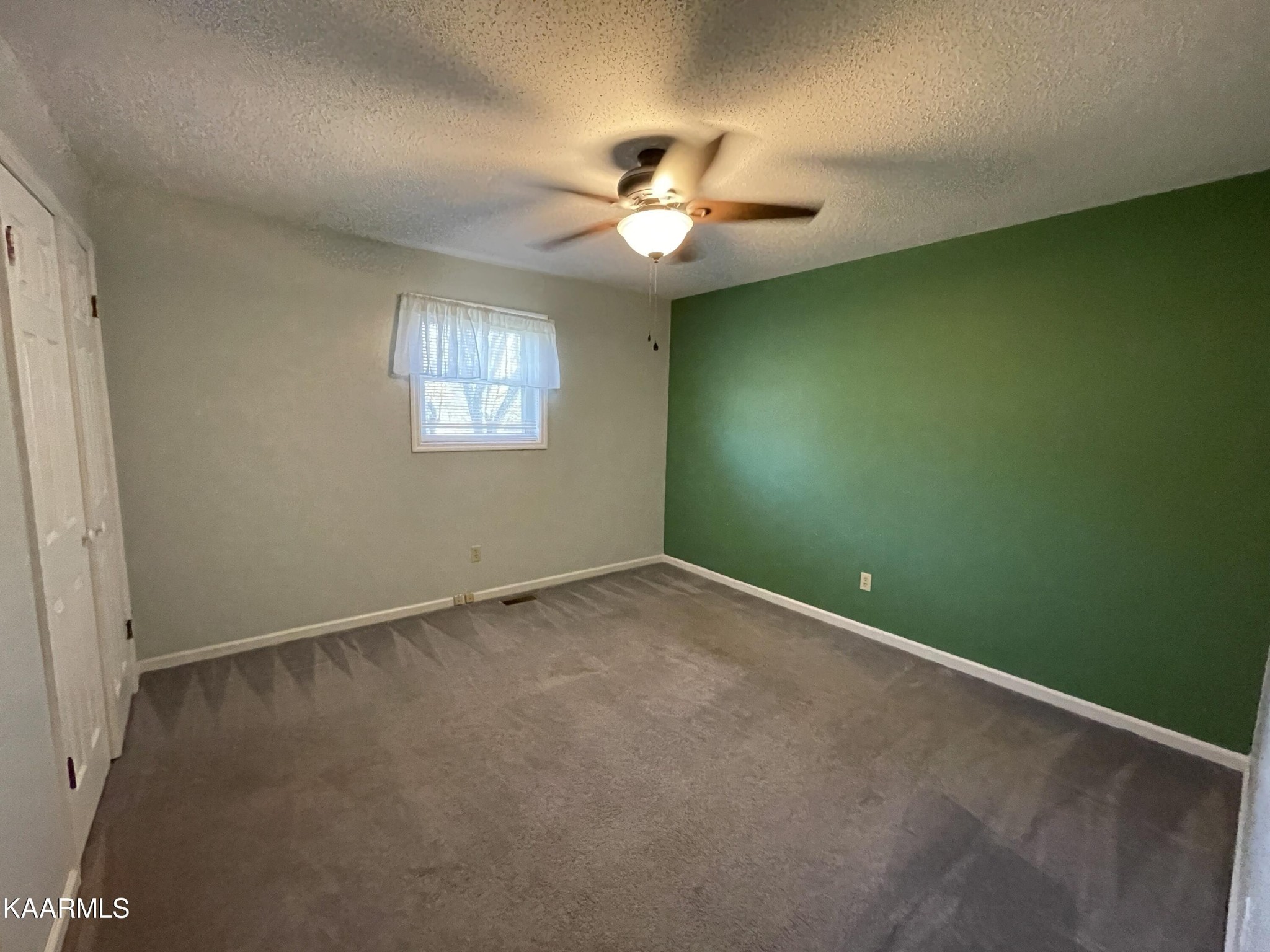 2360 Roslin Road Clarkrange, TN 38553 - Photo 28 of 58 an empty room with a window and a fan