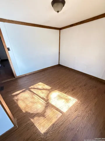 a view of a house with a door and wooden roof
