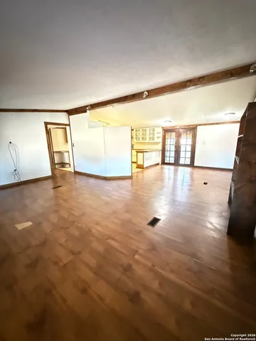 a view of entryway with a tub and a hallway