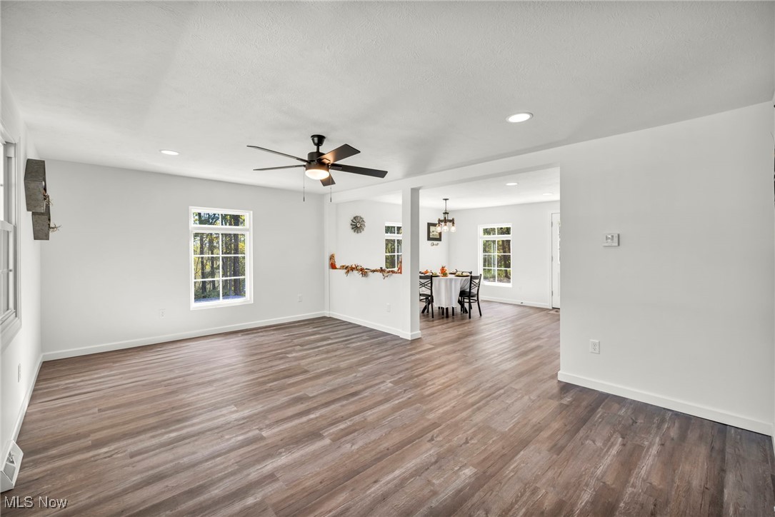 43575 Cream Ridge Road Lisbon, OH 44432 - Photo 5 of 50 Unfurnished living room with dark wood-type flooring, a chandelier, a ceiling fan, and recessed lighting