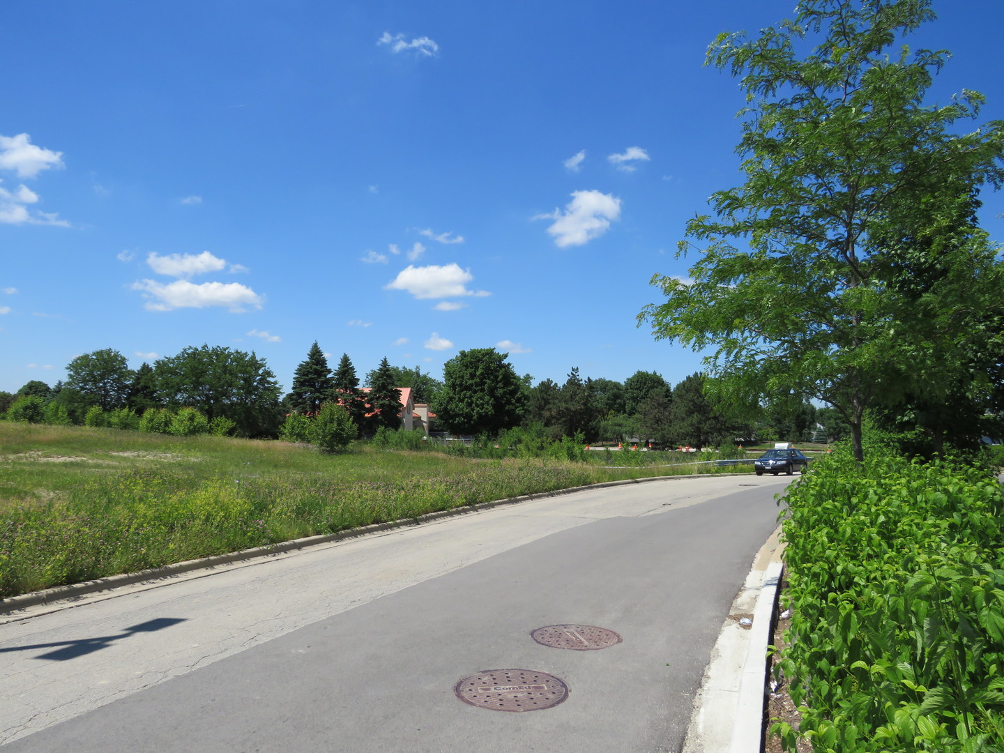 0 North Weber Road Romeoville, IL 60446 - Photo 18 of 28 a view of a street both of side of street with lots of green space and mountain view in back