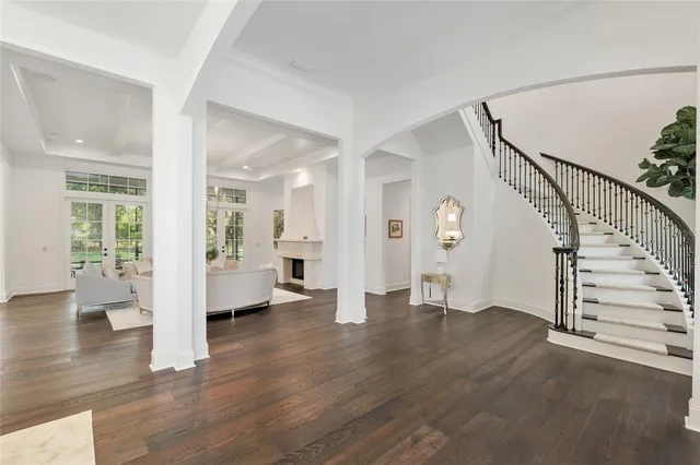 a kitchen with kitchen island granite countertop a sink a stove and cabinets