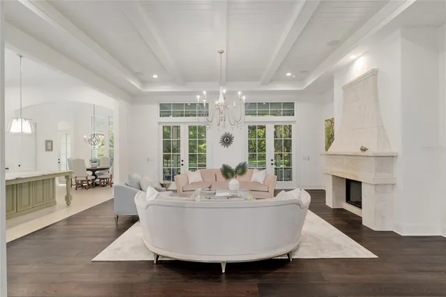 a view of a kitchen with granite countertop a sink and a window
