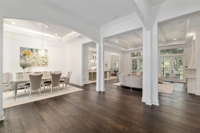 a bathroom with a double vanity sink a mirror and a bathtub
