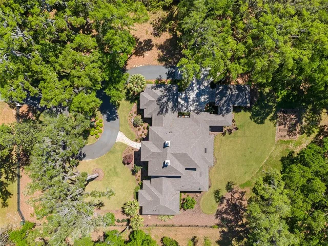 a view of a swimming pool with a yard