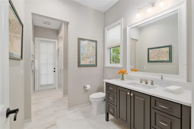 a view of a livingroom with furniture and a window