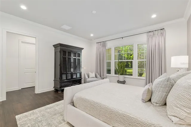 a view of a house with a tree and a yard