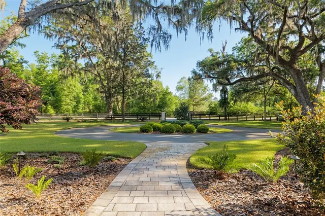 a living room with fireplace a fireplace and a table