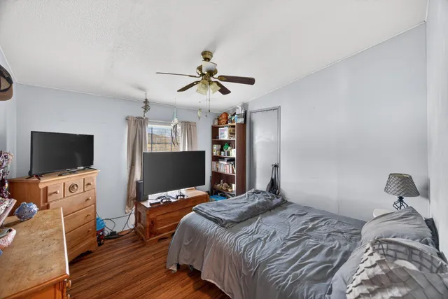 a bed room with a bed and a dresser