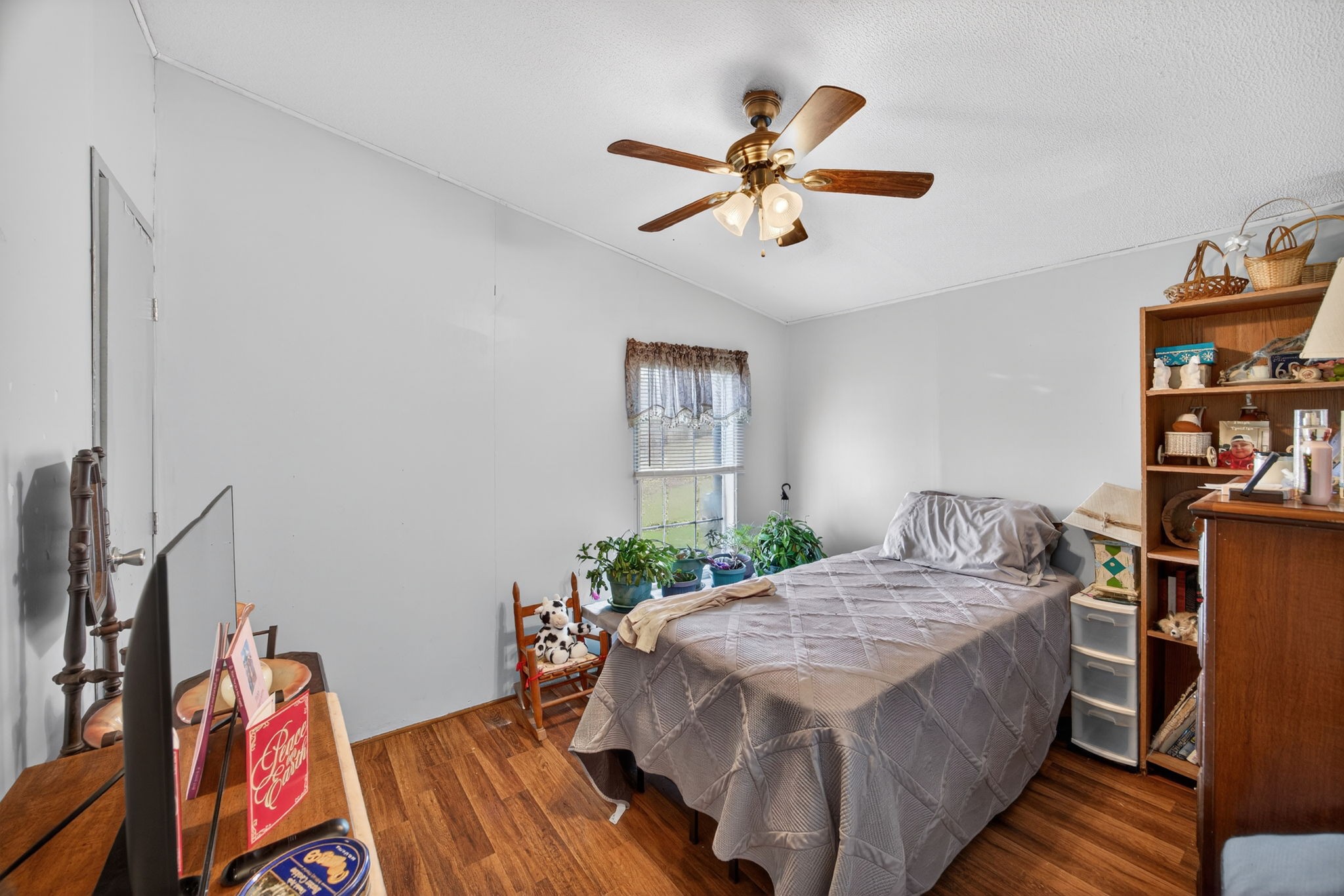 301 Morris Demps Road Sparta, TN 38583 - Photo 16 of 33 a bed sitting in a bedroom next to a window