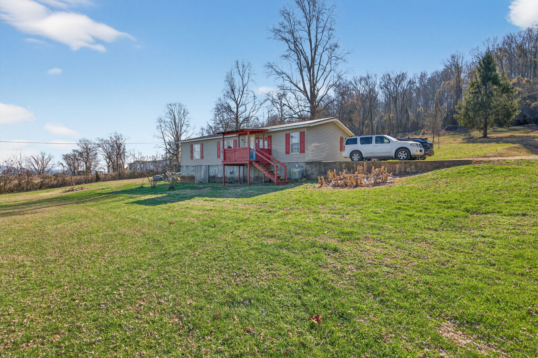 301 Morris Demps Road Sparta, TN 38583 - Photo 24 of 33 a view of a house with a yard and sitting area