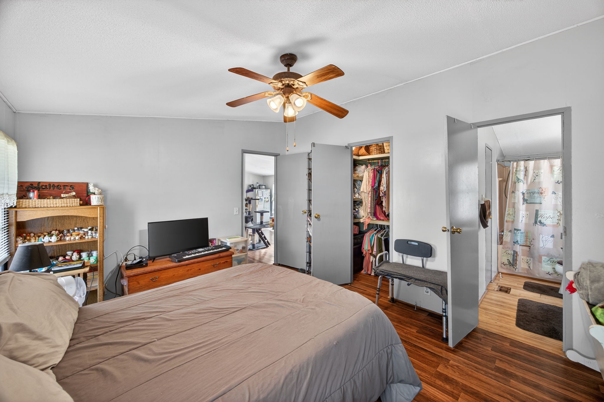 301 Morris Demps Road Sparta, TN 38583 - Photo 10 of 33 a bedroom with a bed and a chandelier