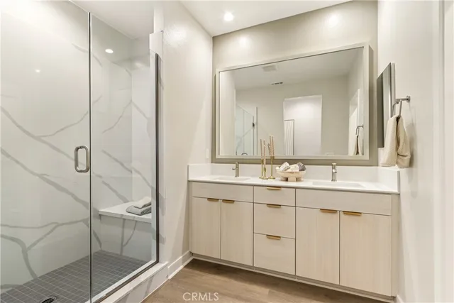 a bathroom with a double vanity sink mirror and double