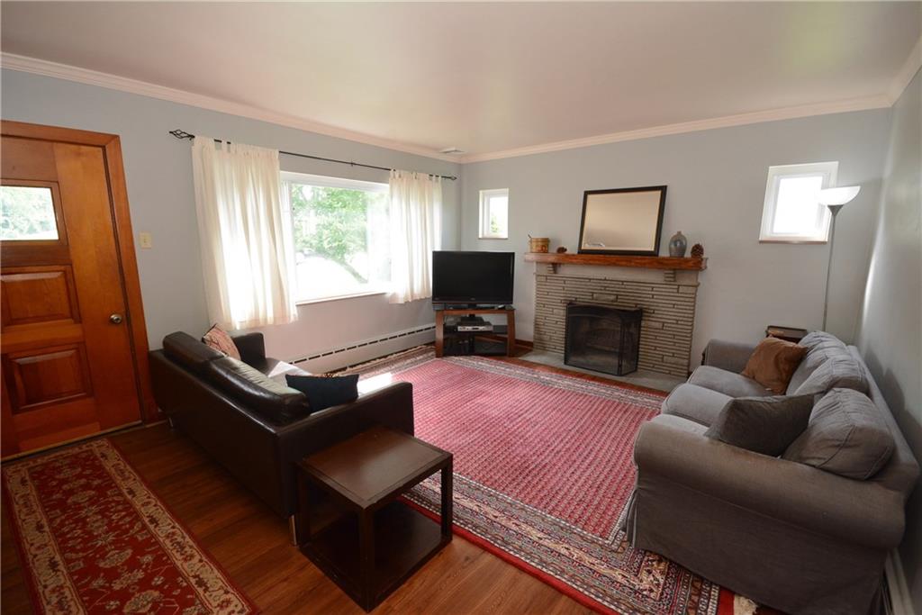 1227 Powers Run Road Pittsburgh, PA 15238 - Photo 5 of 16 Large living room with log burning fireplace