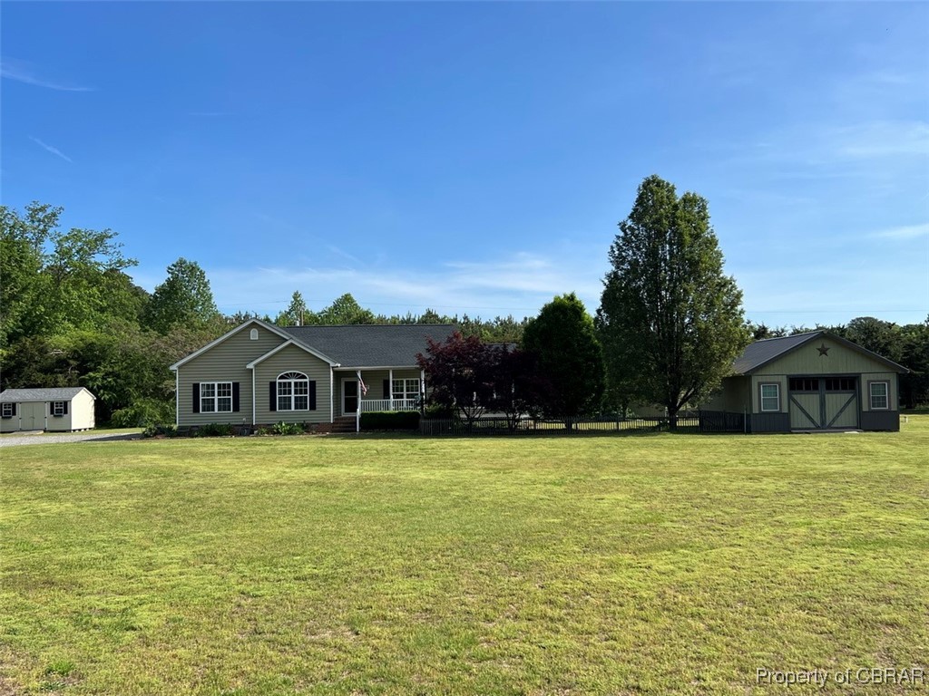 497 Mill Wharf Road Wake, VA 23176 - Photo 25 of 45 View of front facade with a storage shed, an outdoor structure, and a front yard