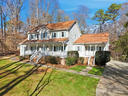 a front view of a residential houses with yard