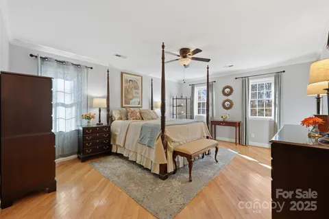 a living room with furniture and a refrigerator