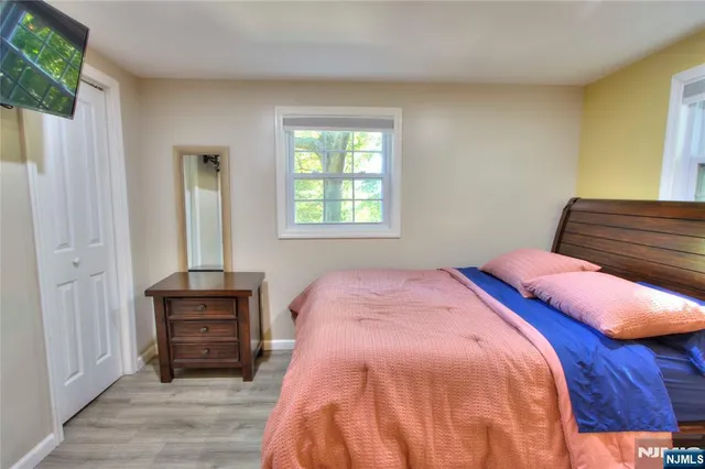 a bedroom with a bed and a closet