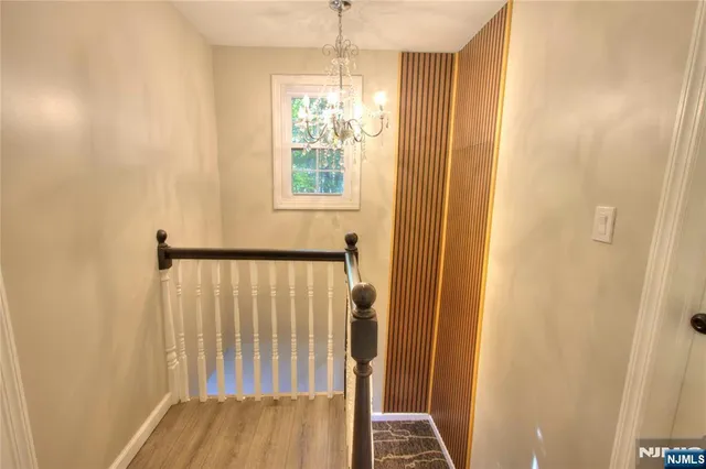 a view of a hallway with windows