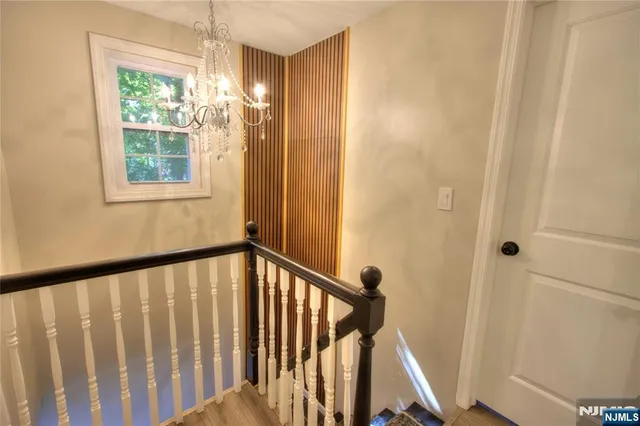 a view of a balcony with wooden floor and stairs