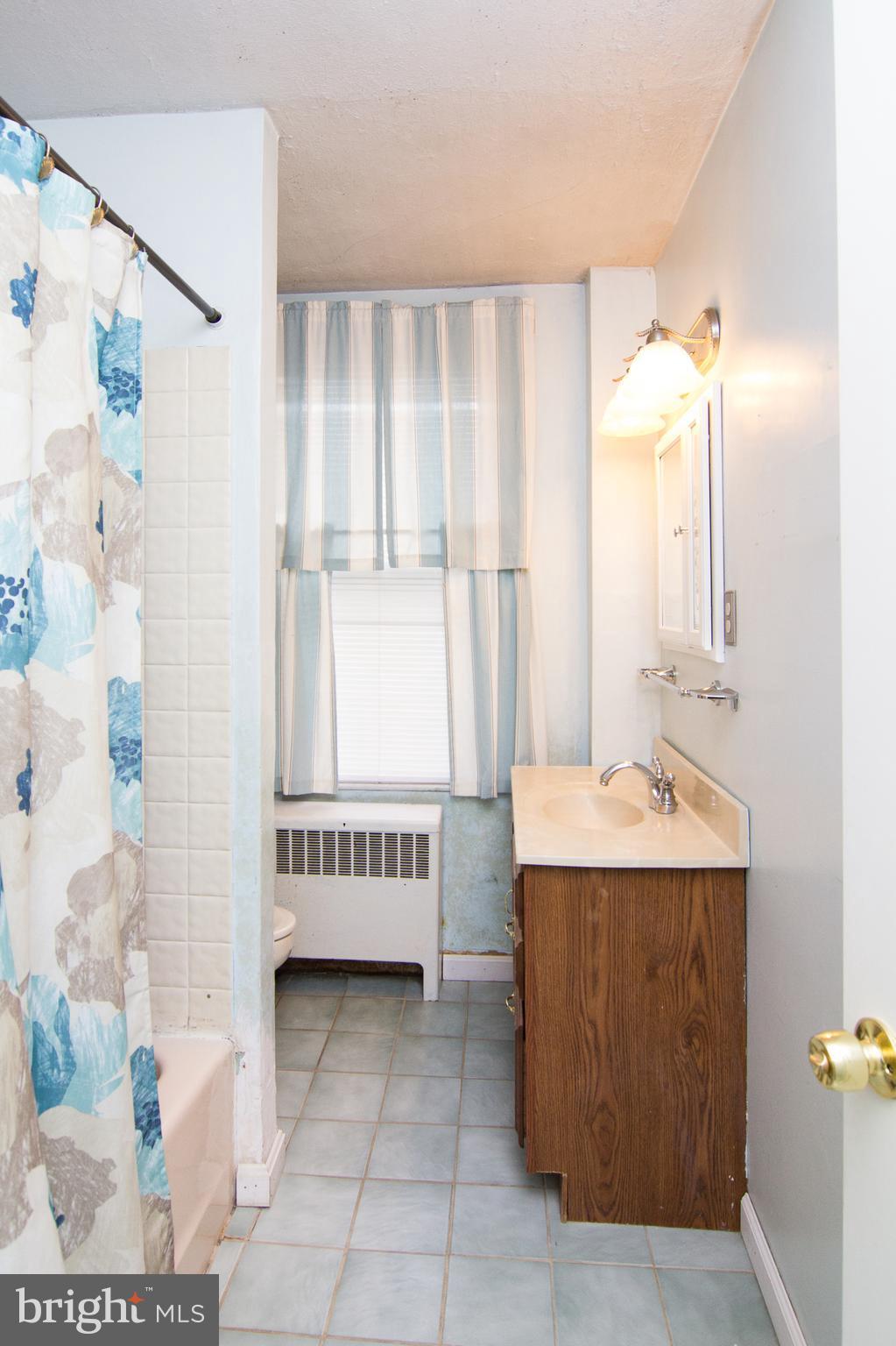 6001 Falls Road Baltimore, MD 21209 - Photo 14 of 30 a view of en suite bathroom with sink and mirror
