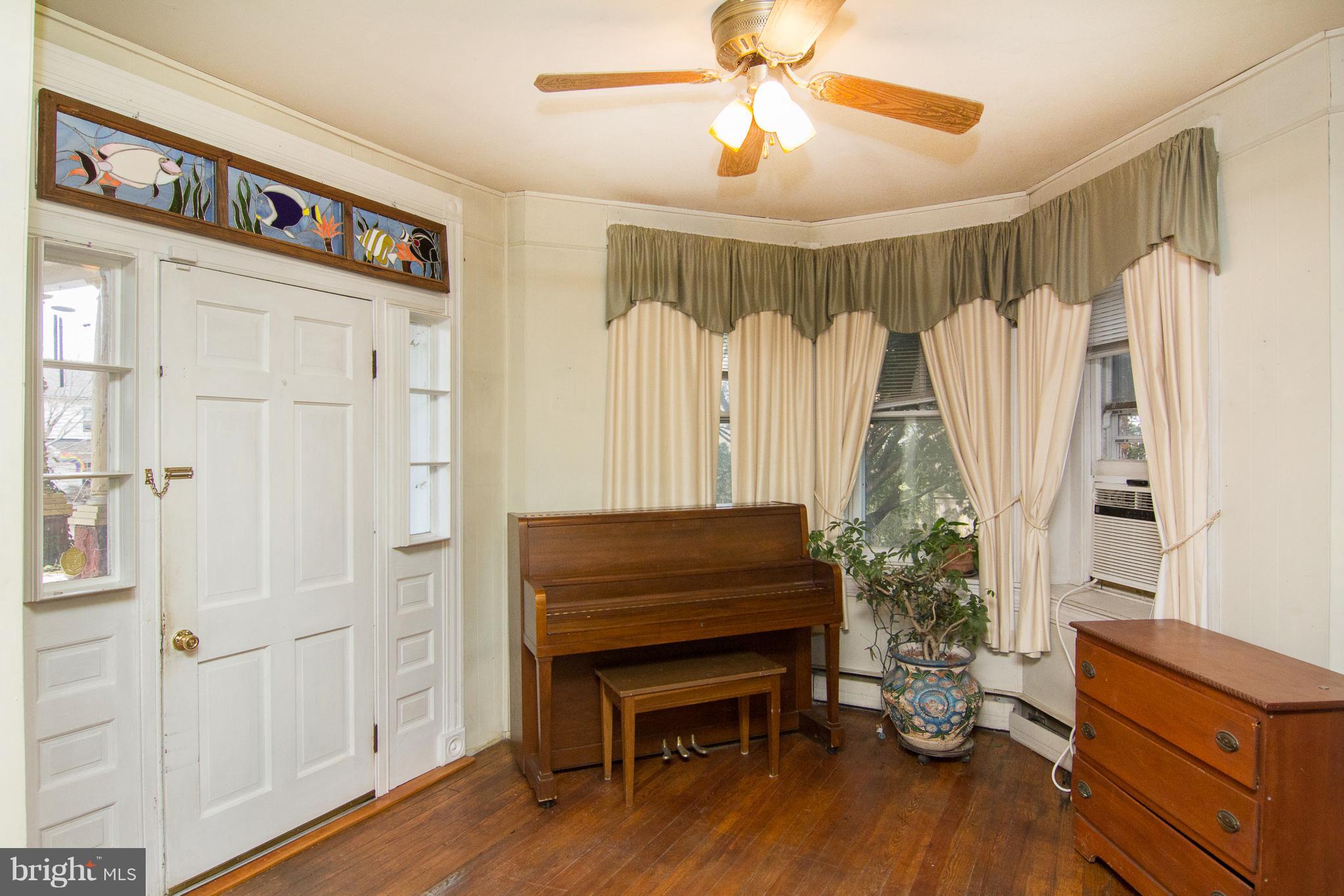 6001 Falls Road Baltimore, MD 21209 - Photo 5 of 30 a view of a livingroom with furniture and hardwood floor