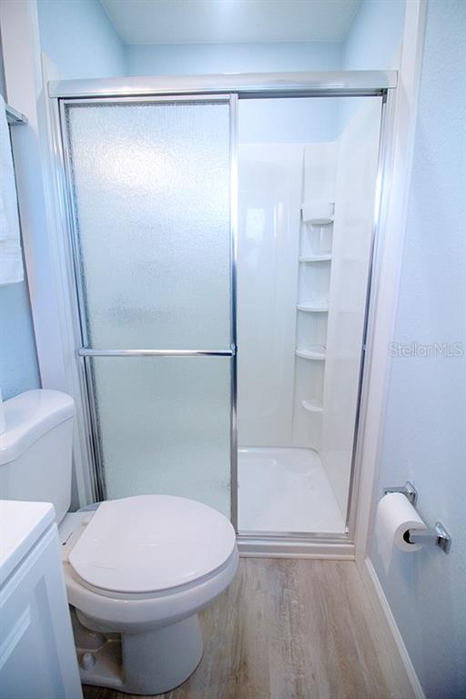 400 Base, Unit 225 Venice, FL 34285 - Photo 8 of 20 a bathroom with a toilet and a shower