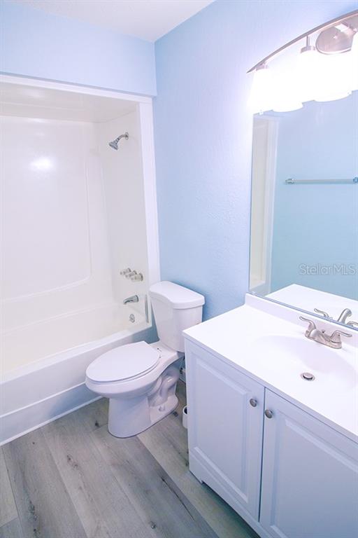 400 Base, Unit 225 Venice, FL 34285 - Photo 10 of 20 a bathroom with a sink a toilet and shower