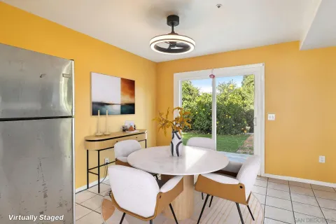 a kitchen with a table and chairs in it