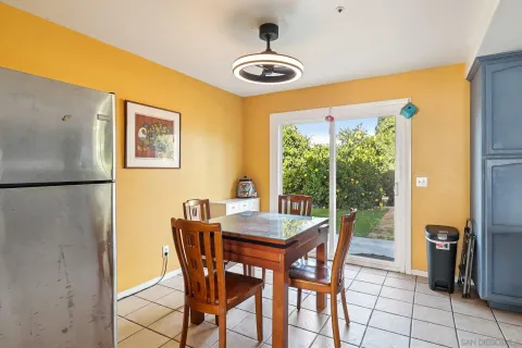 a dining room with furniture and window
