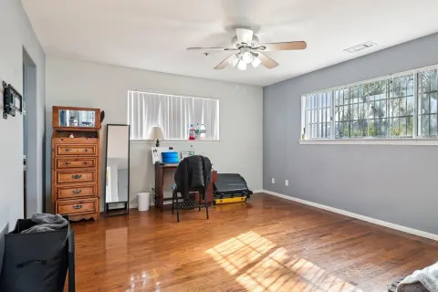 a view of a room with gym equipment and a window