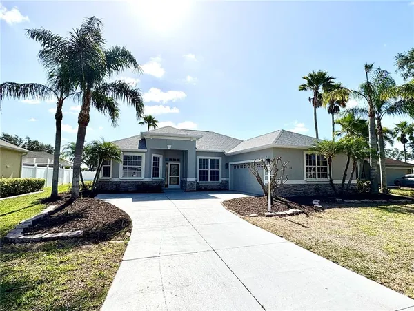 a front view of house with yard outdoor seating and barbeque oven
