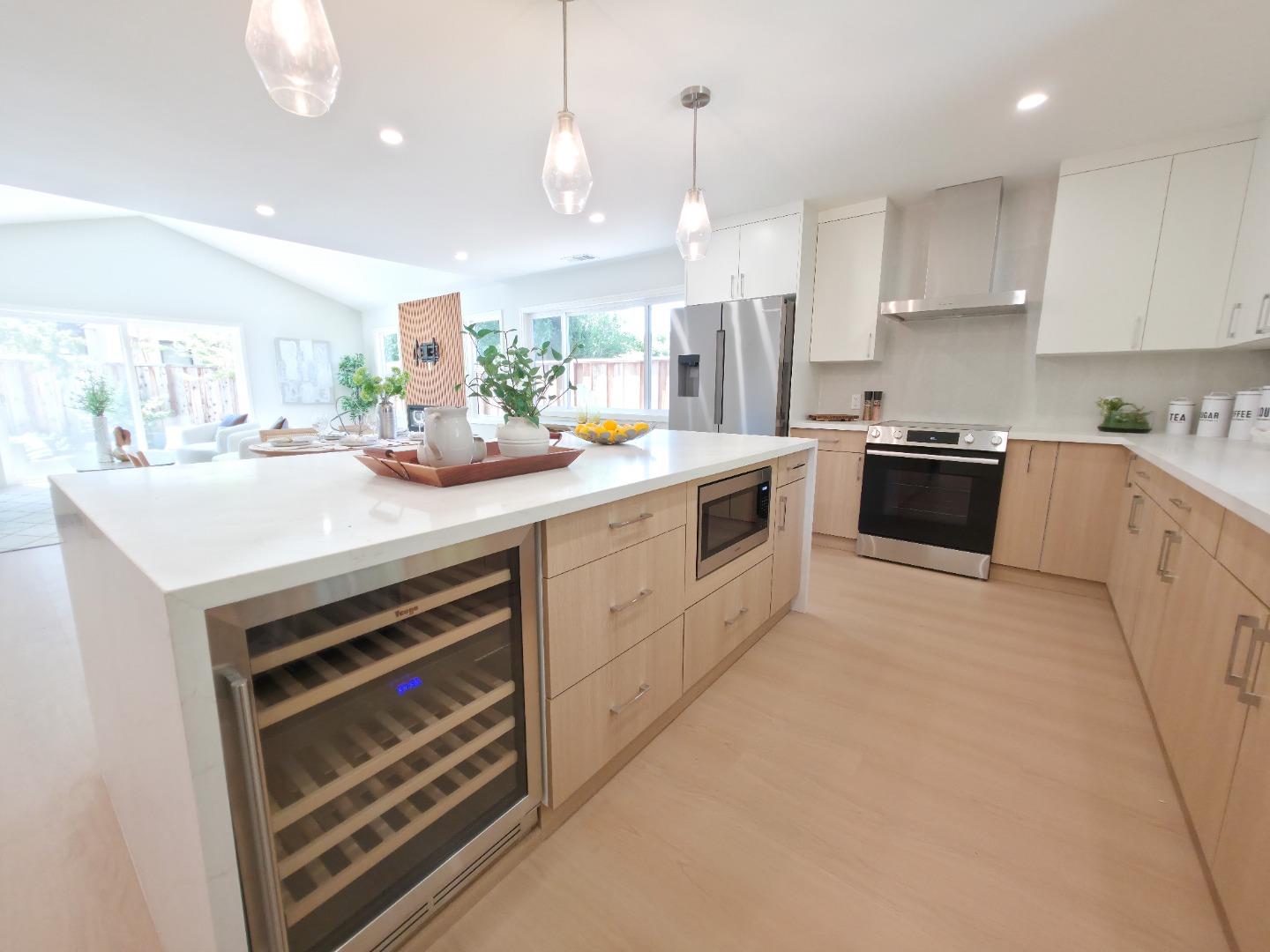 6746 Bollinger Road San Jose, CA 95129 - Photo 6 of 30 a kitchen with a sink and white cabinets