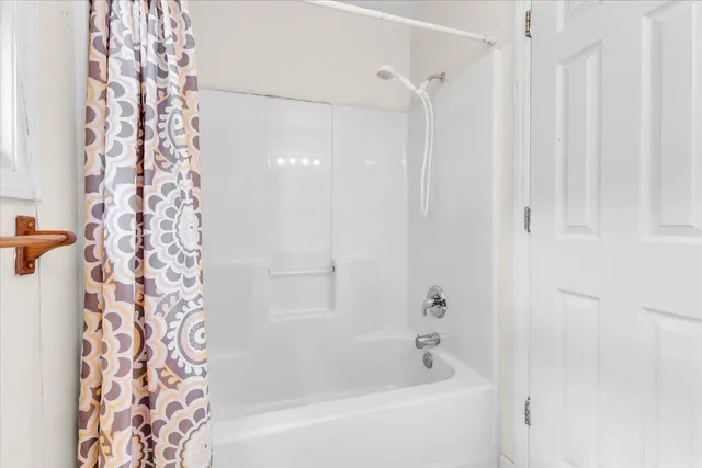 a view of an empty room with windows