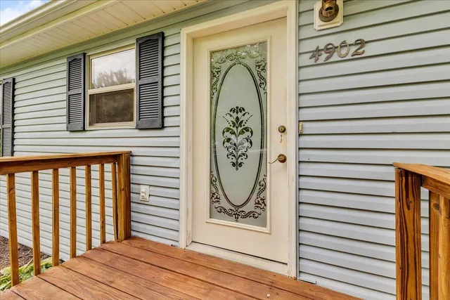 a view of a door of the house with a door