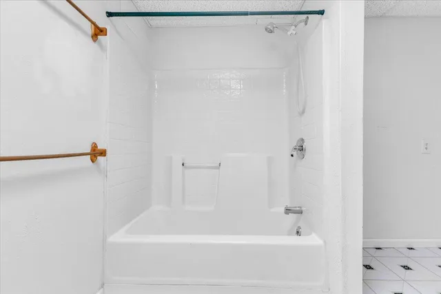 a balcony with view of trees in front of it