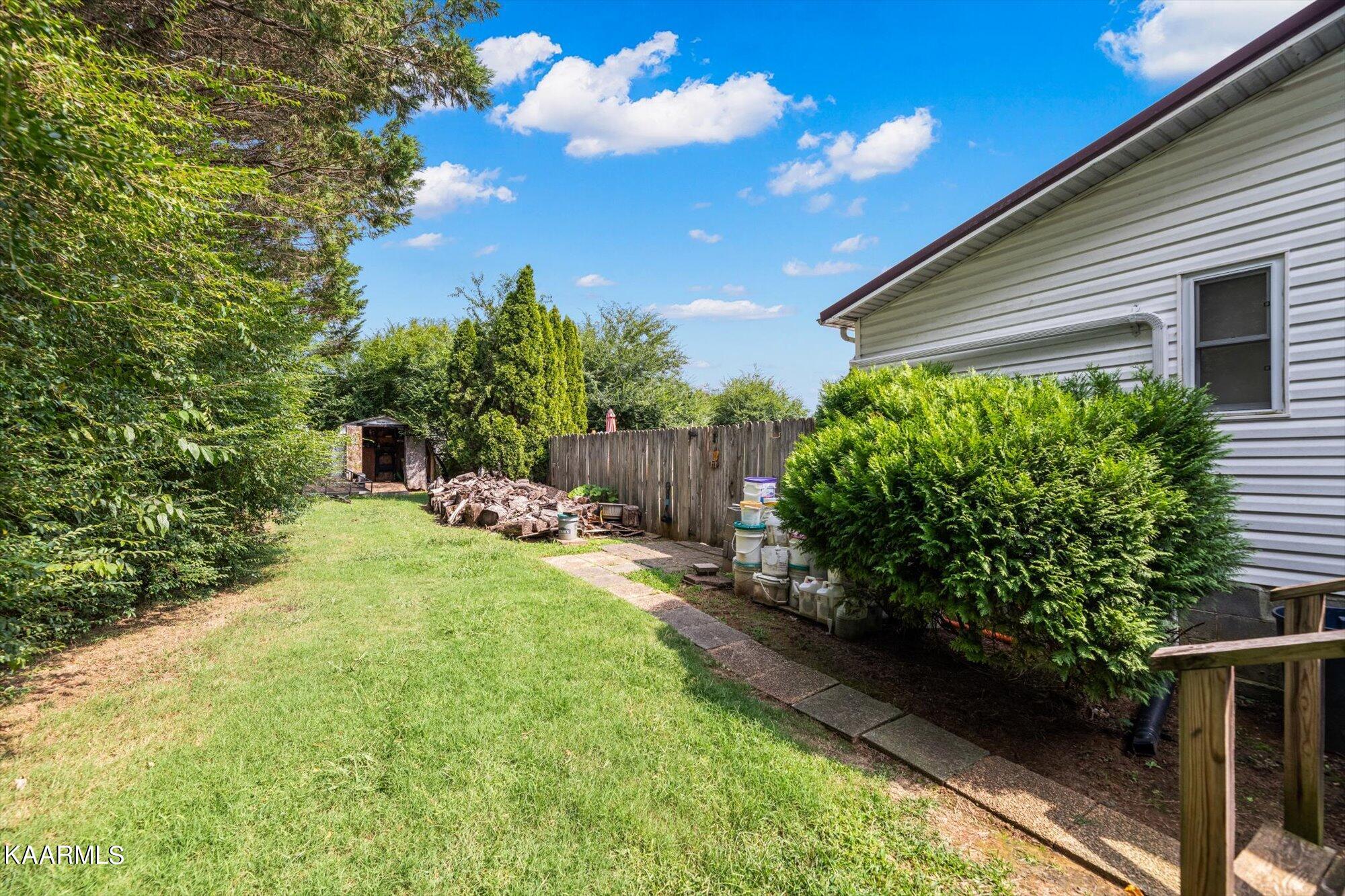 351 Patterson Road Walland, TN 37886 - Photo 17 of 29 Side yard with firewood