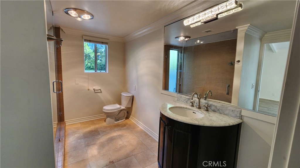 5845 Hilltop Road Hidden Hills, CA 91302 - Photo 12 of 20 a bathroom with a sink toilet and shower