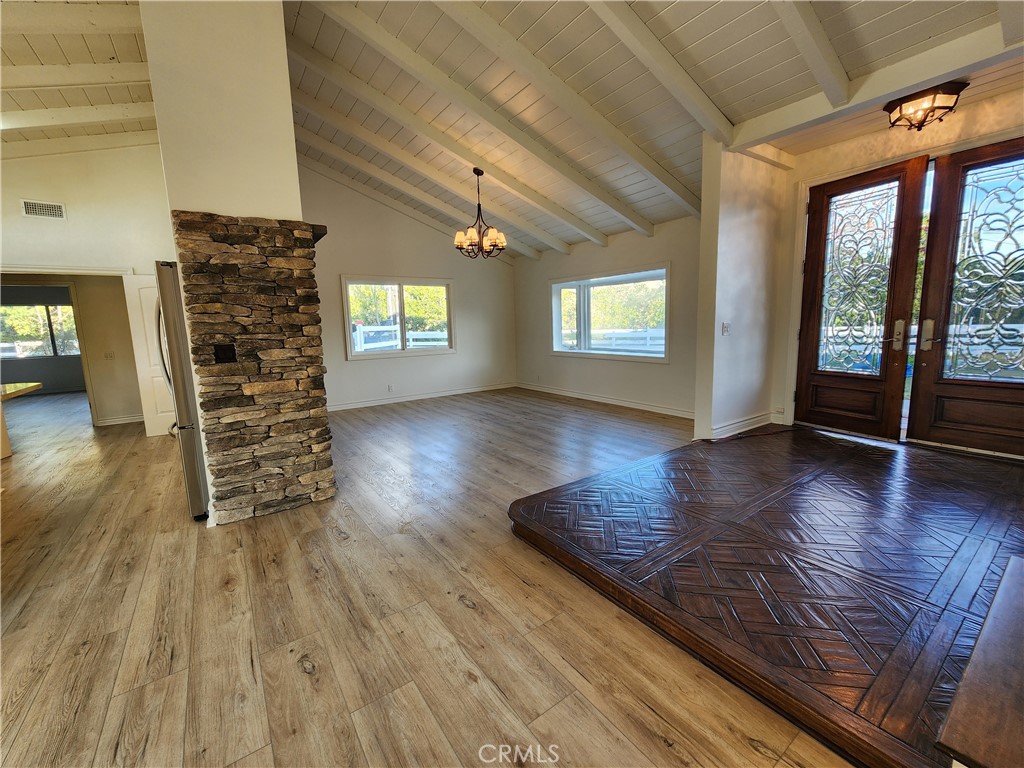 5845 Hilltop Road Hidden Hills, CA 91302 - Photo 2 of 20 wooden floor in an empty room with a window