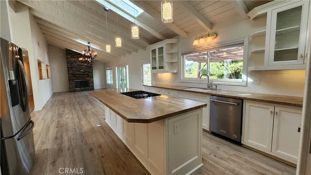 a kitchen with a sink and refrigerator