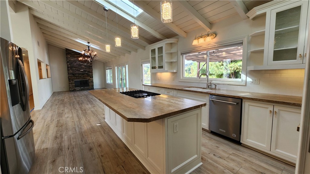 5845 Hilltop Road Hidden Hills, CA 91302 - Photo 6 of 20 a kitchen with a sink and refrigerator