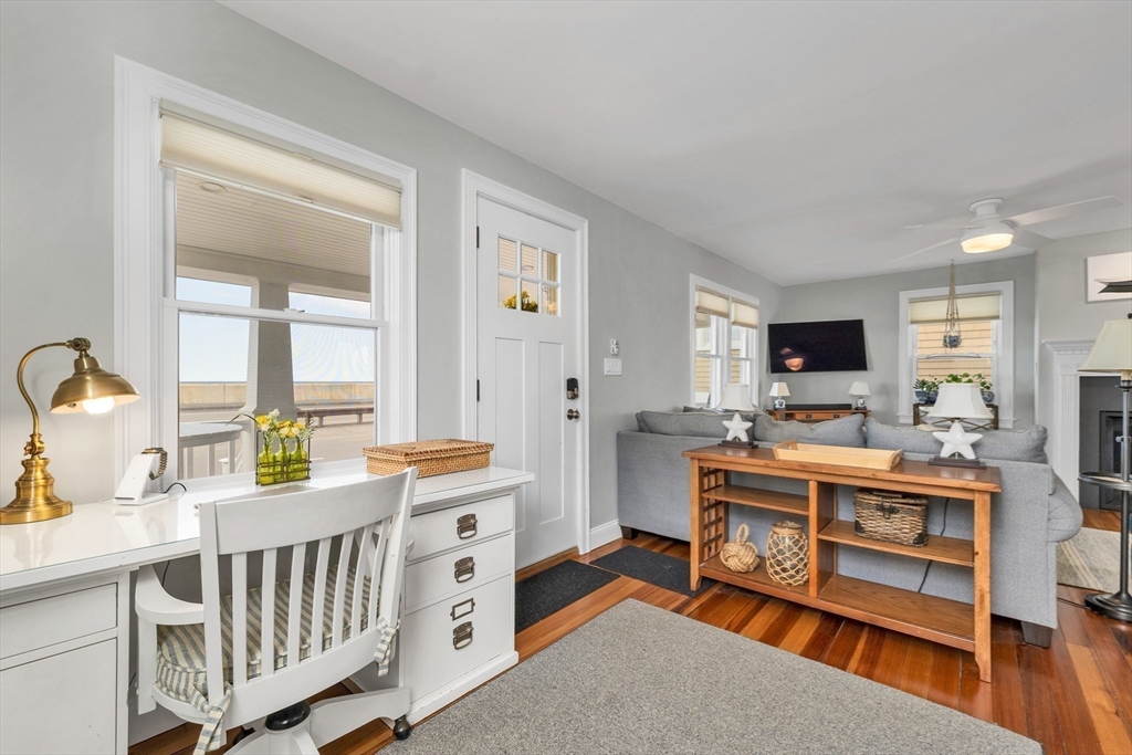 713 Ocean Boulevard Hampton, NH 03842 - Photo 13 of 42 a room with furniture a rug and a window